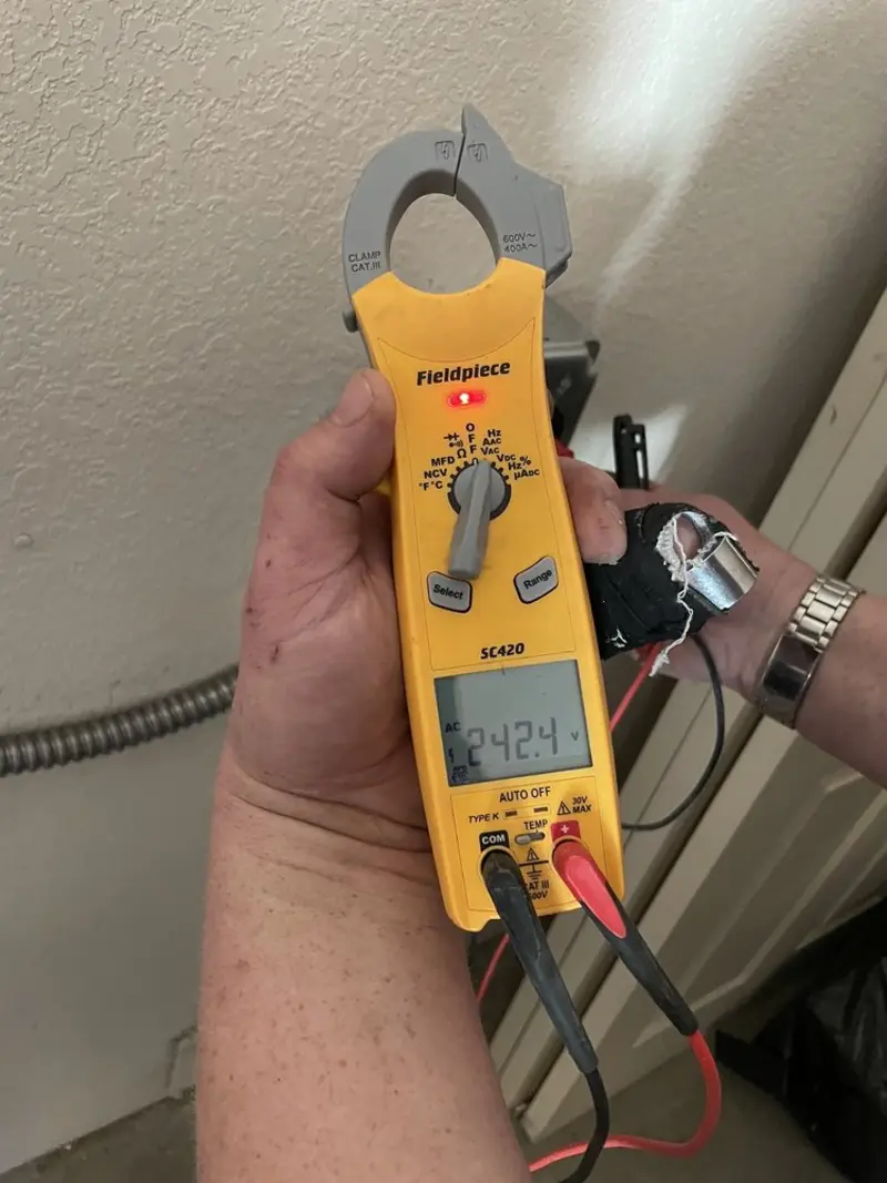 Voltage testing with clamp meter during Circuit Breaker Repair in West Milwaukee